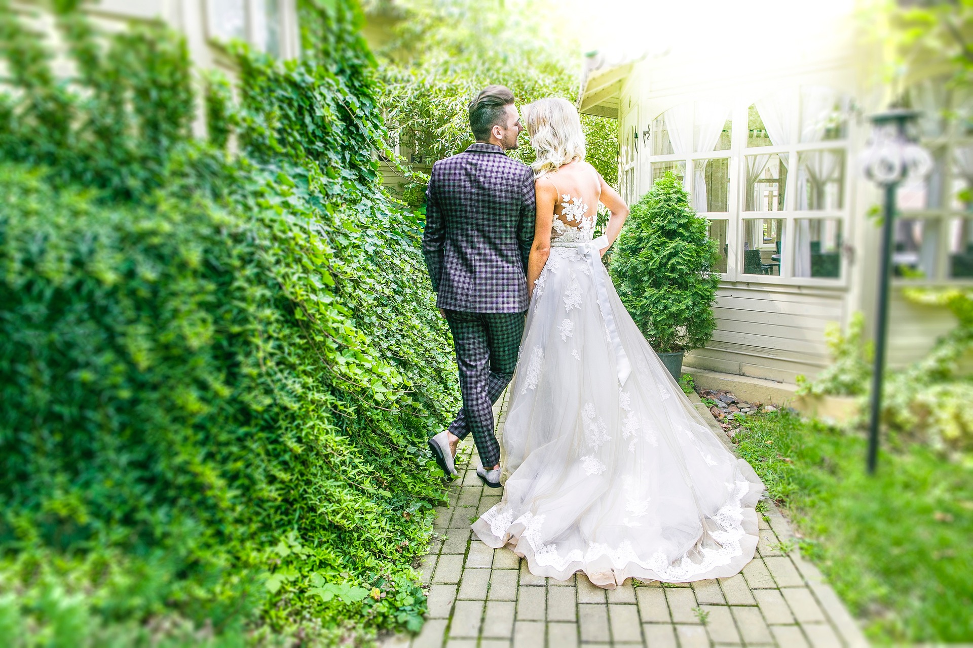 Are you looking for a wedding reception venue in Ann Arbor, Michigan? You have many options to meet your wedding personality, like this bride and groom walking along a path outdoors.